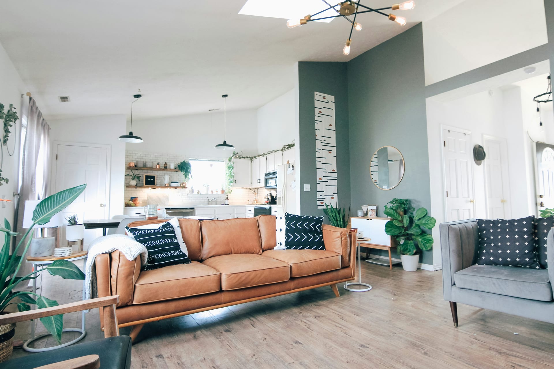 A bright open-plan living space in a short-let apartment, cleaned and reset between guests